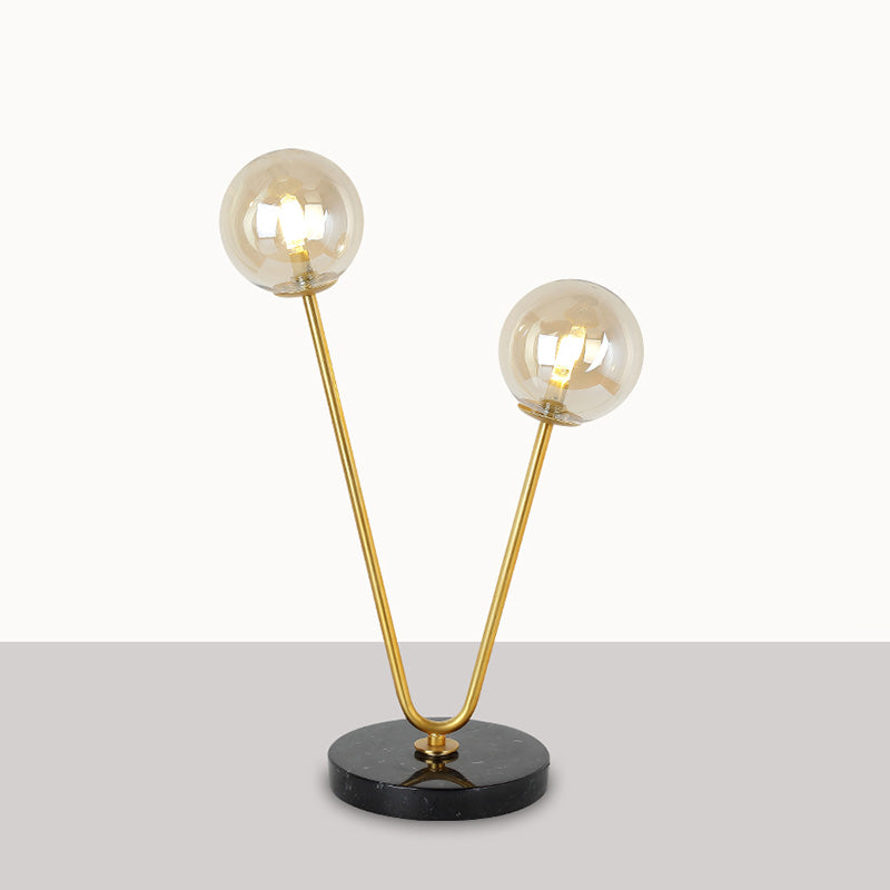 2 Bulbs Bedroom Table Light Post-Modern Black and Gold Night Lamp with Dual Ball Amber Glass Shade Black-Gold Clearhalo 'Lamps' 'Table Lamps' Lighting' 758997