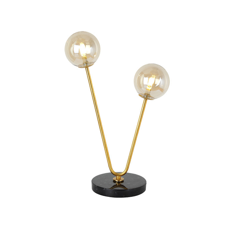 2 Bulbs Bedroom Table Light Post-Modern Black and Gold Night Lamp with Dual Ball Amber Glass Shade Clearhalo 'Lamps' 'Table Lamps' Lighting' 758999