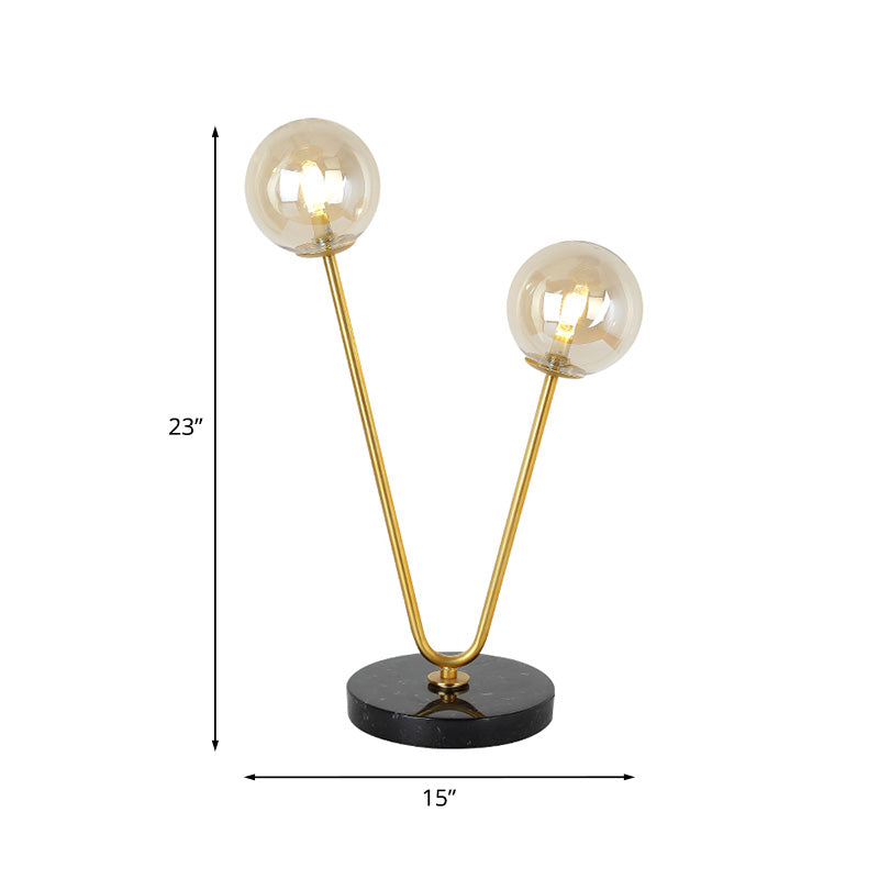 2 Bulbs Bedroom Table Light Post-Modern Black and Gold Night Lamp with Dual Ball Amber Glass Shade Clearhalo 'Lamps' 'Table Lamps' Lighting' 759000
