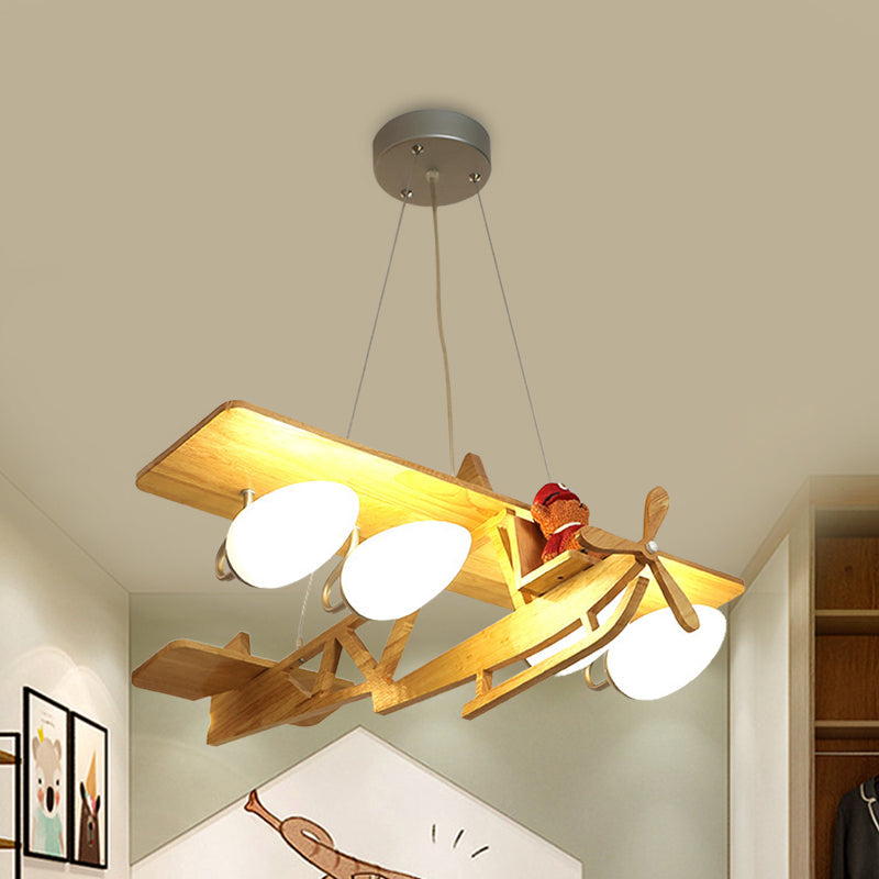 Aircraft Kids Bedroom Pendant Lighting Wood 4-Head Cartoon Chandelier in Beige with Bullet White Glass Shade Wood Clearhalo 'Ceiling Lights' 'Chandeliers' Lighting' options 817136_85303336-f6e4-4556-a6be-00752a896cf3