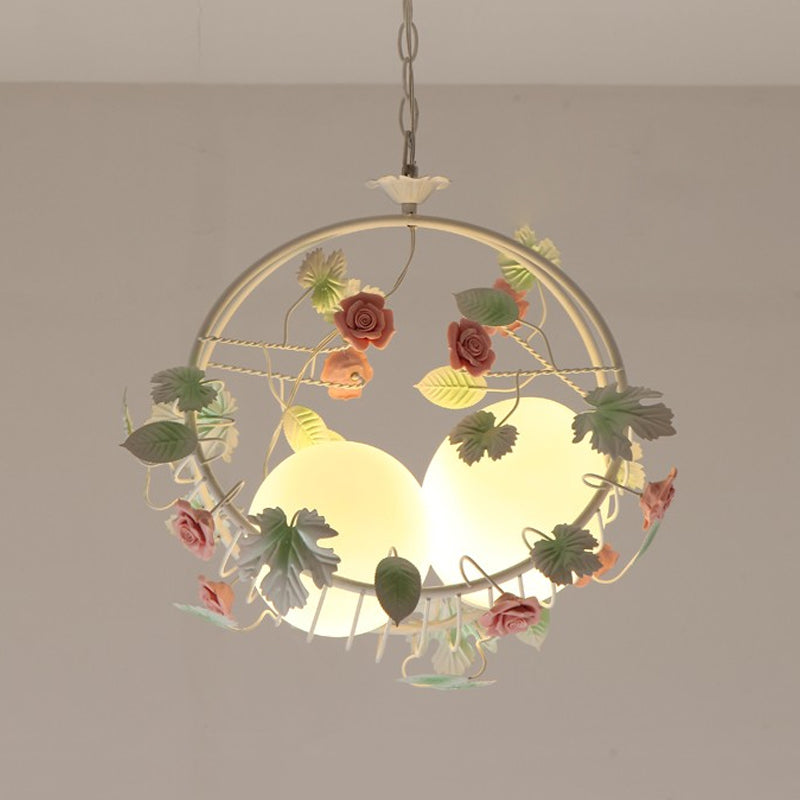 Swing Shaped Iron Hanging Lamp Korean Flower 2 Bulbs Dining Table Chandelier in Pink with Ball Glass Shade Clearhalo 'Ceiling Lights' 'Chandeliers' Lighting' options 882096