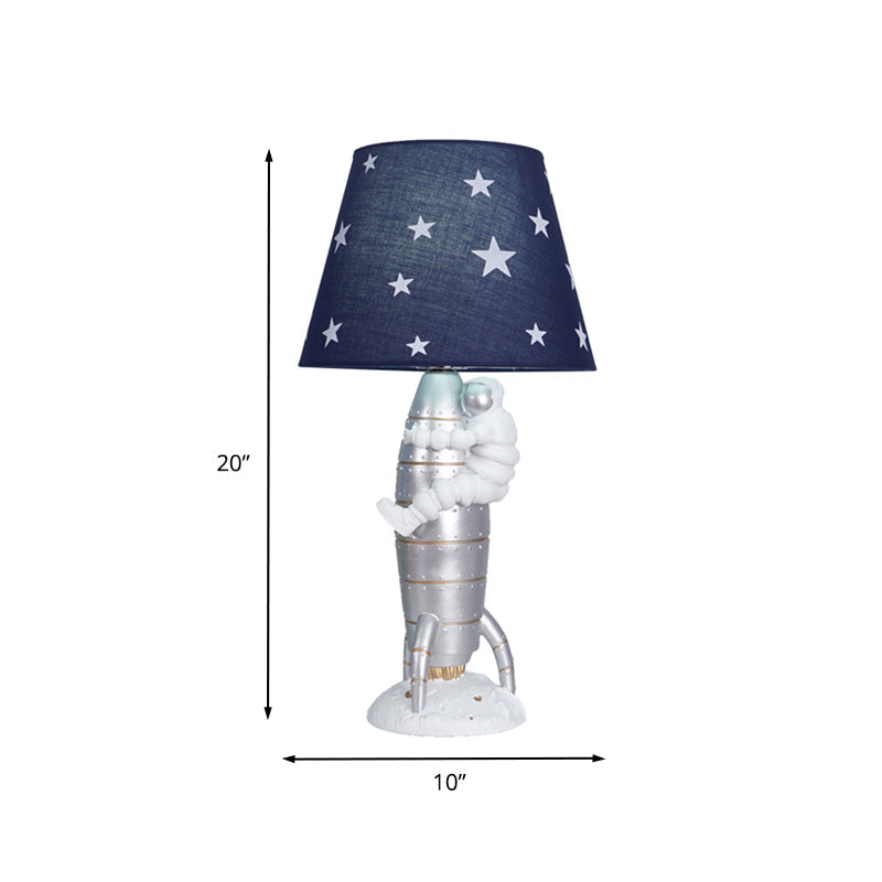 Silver Rocket and Astronaut Table Light Kids 1 Bulb Resin Night Lamp with Barrel Fabric Shade Clearhalo 'Lamps' 'Table Lamps' Lighting' 882748