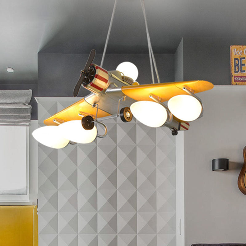 Yellow Aircraft Chandelier Lamp Cartoon 4-Light Metal Suspension Light with Cream Glass Shade Yellow Clearhalo 'Ceiling Lights' 'Chandeliers' Lighting' options 898178_ff684ac5-acc9-4537-a285-d90504eff439