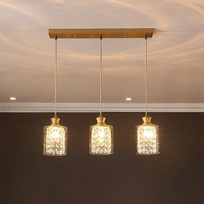 Cylinder Faceted Crystal Multi-Light Pendant Modernist 3 Heads Gold Hanging Lamp with Clear Glass Shade Gold Clearhalo 'Ceiling Lights' 'Close To Ceiling Lights' 'Glass shade' 'Glass' 'Modern Pendants' 'Modern' 'Pendant Lights' 'Pendants' Lighting' 916247